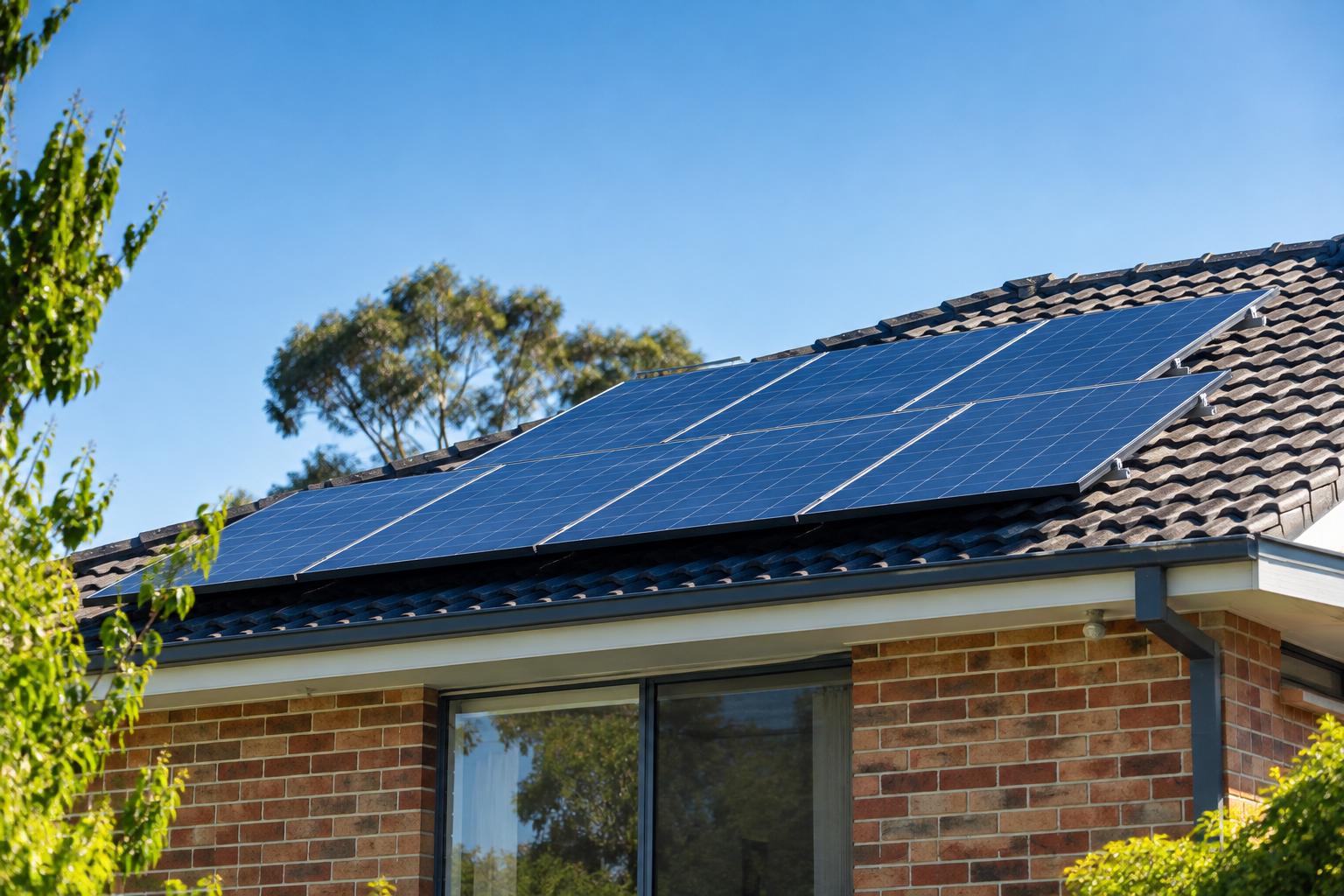 Solar panels on a brick home with tiled roof in Sydney